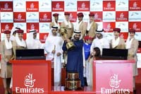 Saeed bin Suroor accepts the Dubai World Cup (Group 1), from His Highness Sheikh Mohammed bin Rashid Al Maktoum, on 19th running of the Dubai World Cup, Saturday March 29th -2014. 